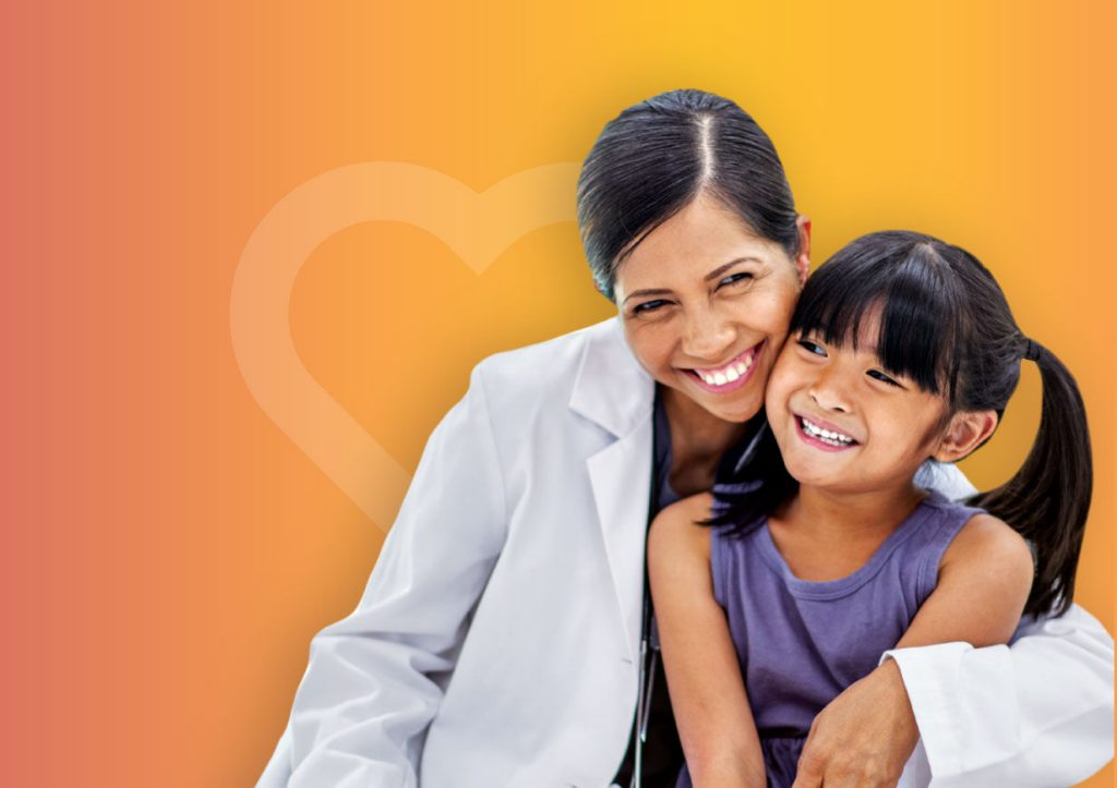 Smiling doctor with child patient
