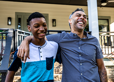 Two young people happily after qualifying for Covered California health insurance in the Inland Empire.