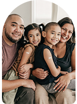 Inland Empire family cuddle up on the couch with each other after getting the flu shot.