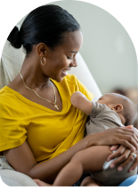 Black woman breastfeeding her baby