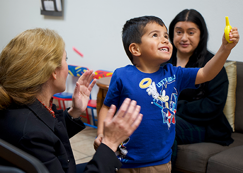 Dr. Pardis Amirhoushmand works with Mateo, 4, and his mom inside The Autism Center in Ontario on April 17.