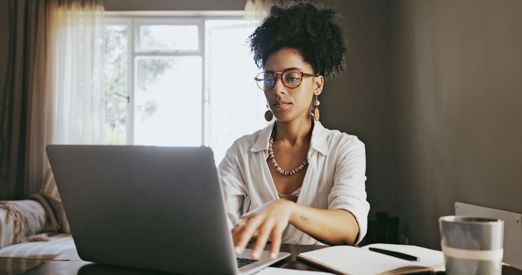 young hispanic woman on computer