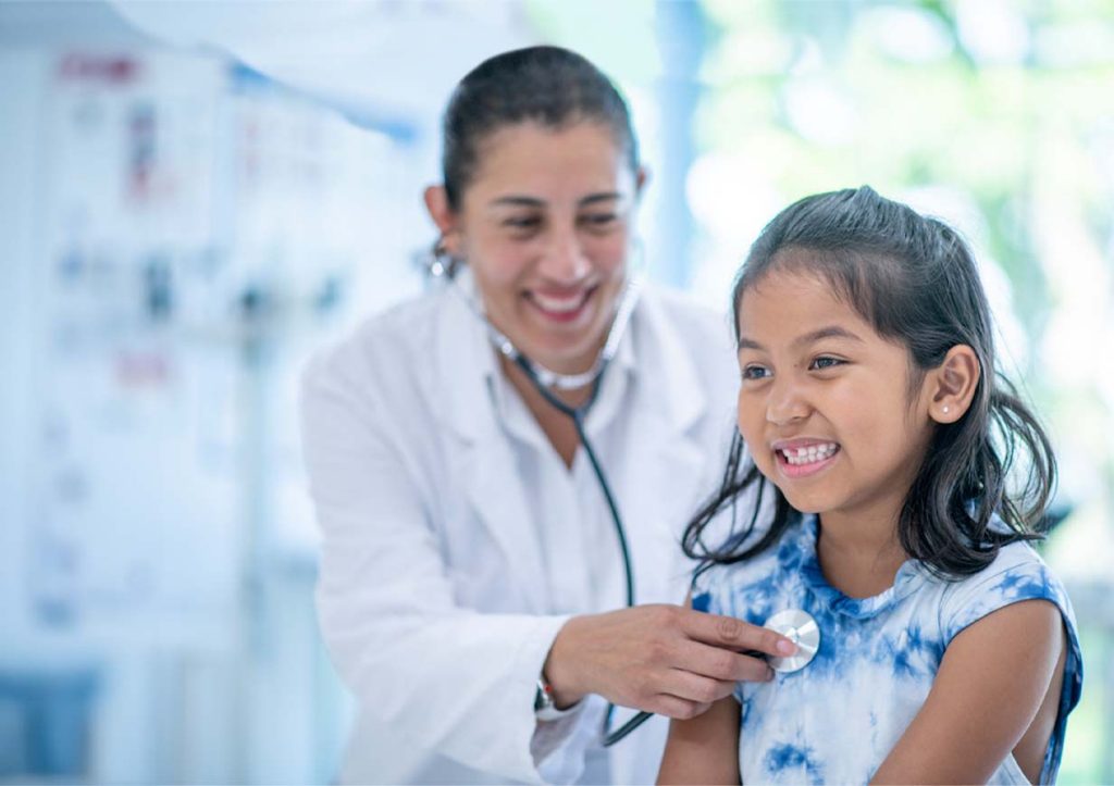 Pediatrician with young patient