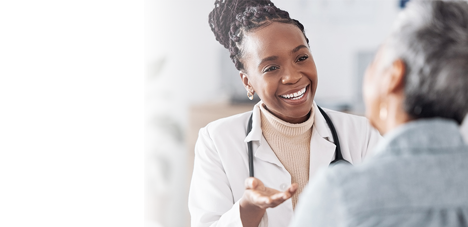 Black woman doctor talking to patient 
