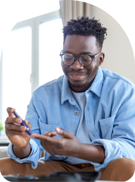 black man checking glucose levels