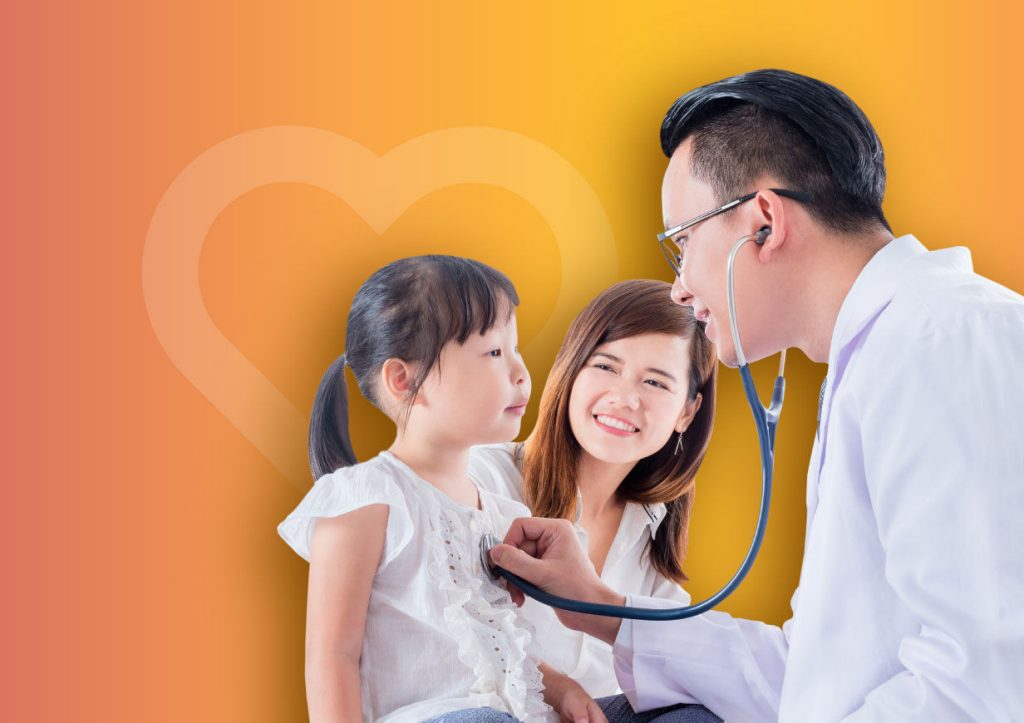Smiling doctor with child patient
